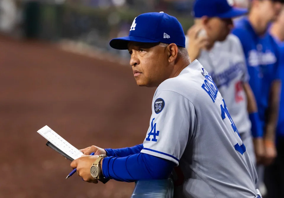 Los Angeles Dodgers manager Dave Roberts watches intently at Chase Field in 2025.Mark J&period; Rebilas-Imagn Images