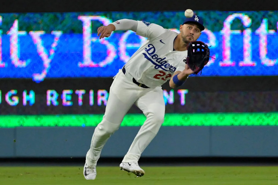Los Angeles Dodgers left fielder Michael Conforto (23) makes a running catch off New York Mets third baseman Brett Baty (7) in the fifth inning at Dodger Stadium.Jayne Kamin-Oncea-Imagn Images