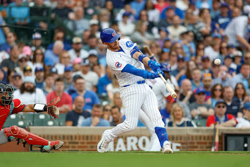 Chicago Cubs catcher Carson Kelly (15) hits a two-run home run against the Arizona Diamondbacks during the second inning at Wrigley Field in Chicago on April 18, 2025.