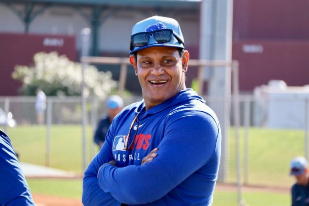 Sammy Sosa smiles during a workout at Cubs spring training...