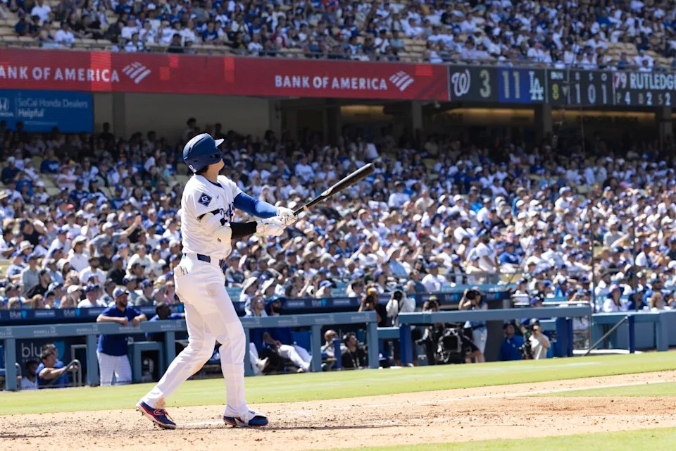 Dodgers star Shohei Ohtani hits a home run in the eighth inning Sunday against the Nationals.
