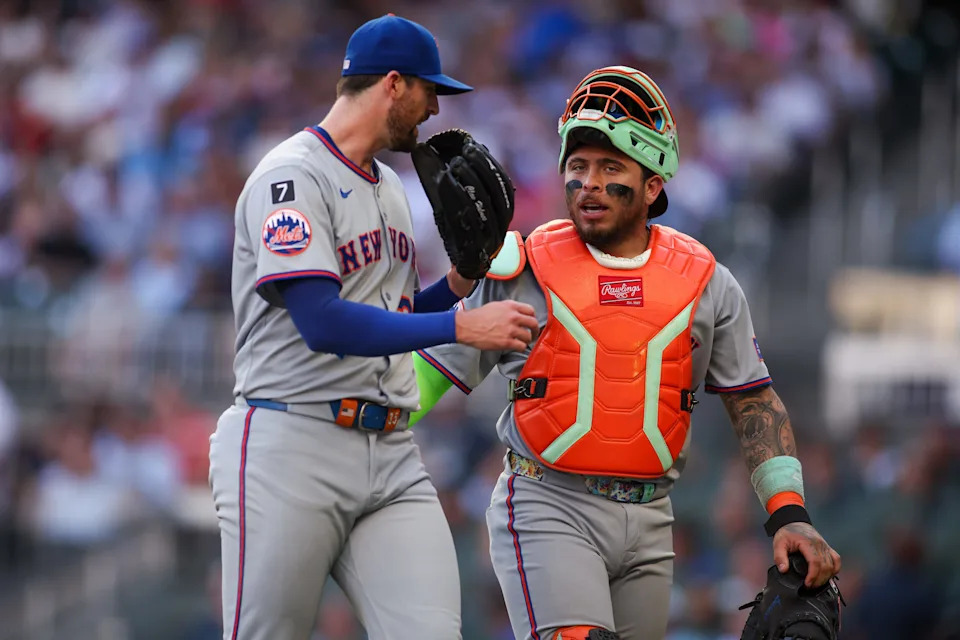 New York Mets starting pitcher Clay Holmes (35) talks to catcher Francisco Alvarez (4) against the Atlanta Braves after the first inning on June 19, 2025, at Truist Park.