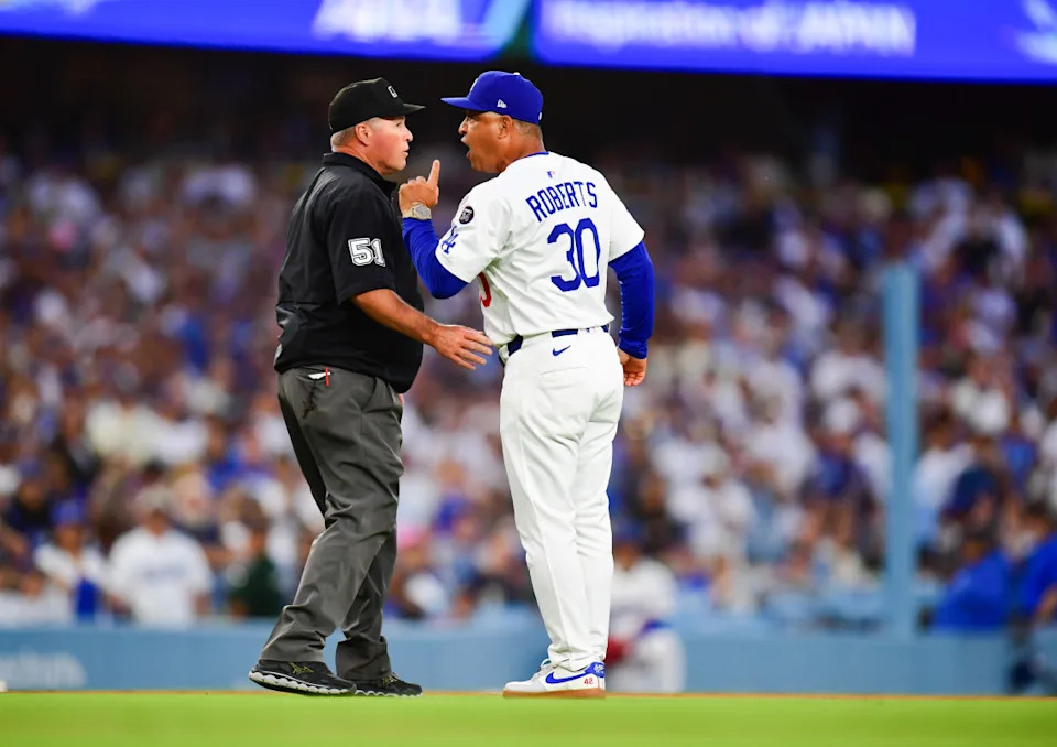 Los Angeles Dodgers manager Dave Roberts (30) argues with umpire Marvin Hudson (51) during the third inning against the San Diego Padres at Dodger Stadium.Gary A&period; Vasquez-Imagn Images