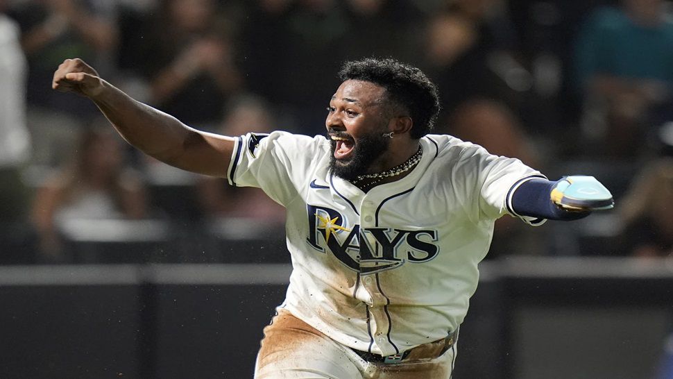 Tampa Bay Rays' Junior Caminero reacts after scoring the game-winning run on an RBI single by Taylor Walls off Texas Rangers pitcher Robert Garcia during the ninth inning of a baseball game Thursday, June 5, 2025, in Tampa, Fla. (AP Photo/Chris O'Meara)