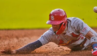 St. Louis Cardinals' Masyn Winn dives back into first base as the ball gets away from Cleveland Guardians first baseman Kyle Manzardo on a pickoff-attempt in the third inning of a baseball game in Cleveland, Friday, June 27, 2025.
