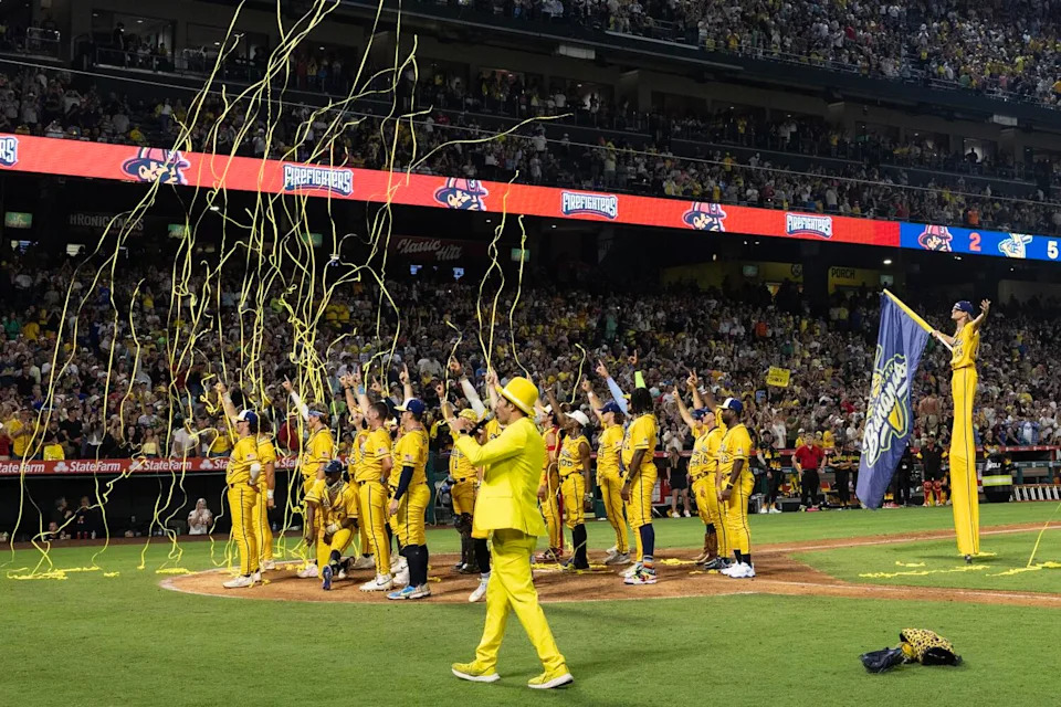 The Savannah Bananas celebrate amid confetti after beating the Firefighters at Angel Stadium on Friday.