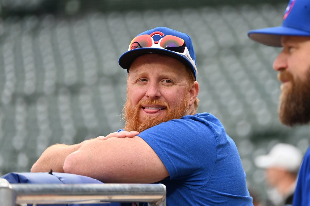 Justin Turner of the Chicago Cubs smiles during warm-ups.