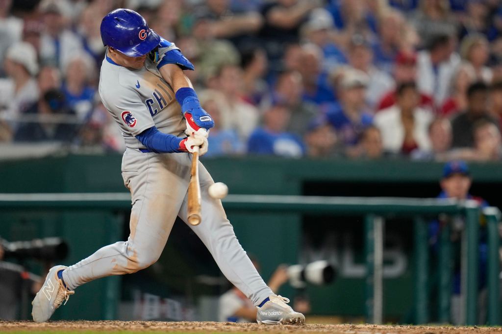 Matt Shaw of the Chicago Cubs hitting a baseball.