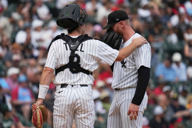 White Sox catcher Kyle Teel talks with reliever Cam Booser during the eighth inning in the first game of a doubleheader against the Cardinals on June 19, 2025. (AP Photo/Nam Y. Huh)