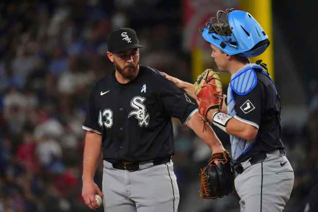 White Sox starter Aaron Civale comes off the field with catcher Kyle Teel during a game against the Rangers on Sunday, June 15, 2025, in Arlington, Texas. (AP Photo/LM Otero)