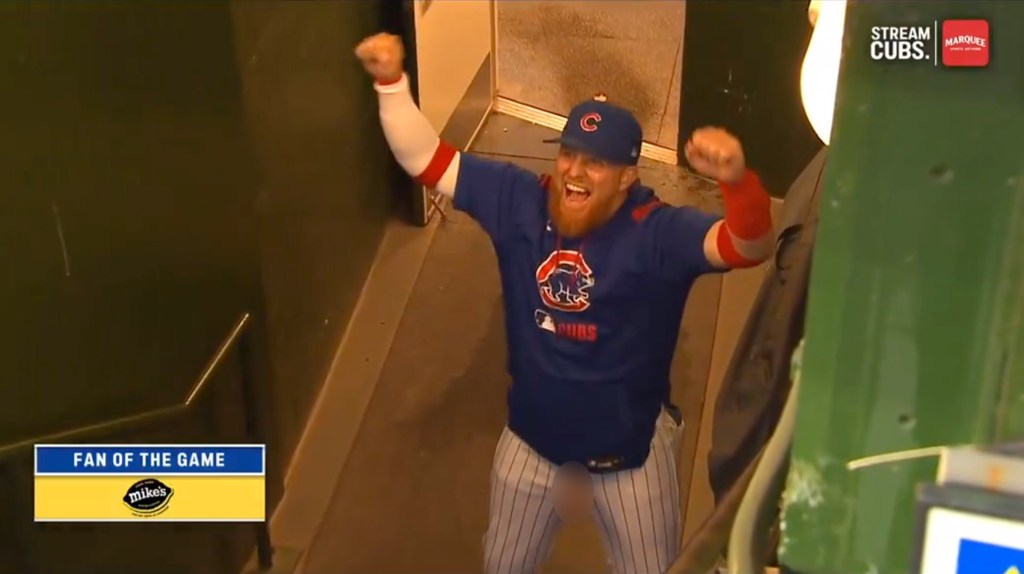 Justin Turner jumps around to celebrate for the Cubs.