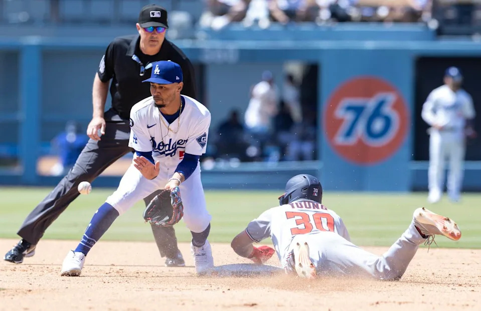 Dodgers shortstop Mookie Betts fields a throw and tags out the Washington Nationals' Jacob Young at second base.