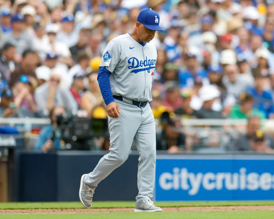 Los Angeles Dodgers manager Dave Roberts (30) walks to the mound to make a pitching change during the seventh inning against the San Diego Padres at Petco Park.David Frerker-Imagn Images