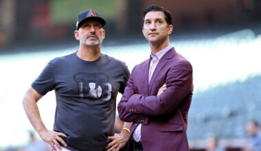 Diamondbacks GM Mike Hazen and skipper Torey Lovullo look on...