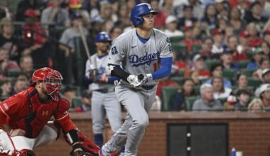 Los Angeles Dodgers' Shohei Ohtani, right, watches his single next to St. Louis Cardinals catcher Pedro Pages, left, in the third inning of a baseball game, Friday, June 6, 2025, in St. Louis. (AP Photo/Joe Puetz)