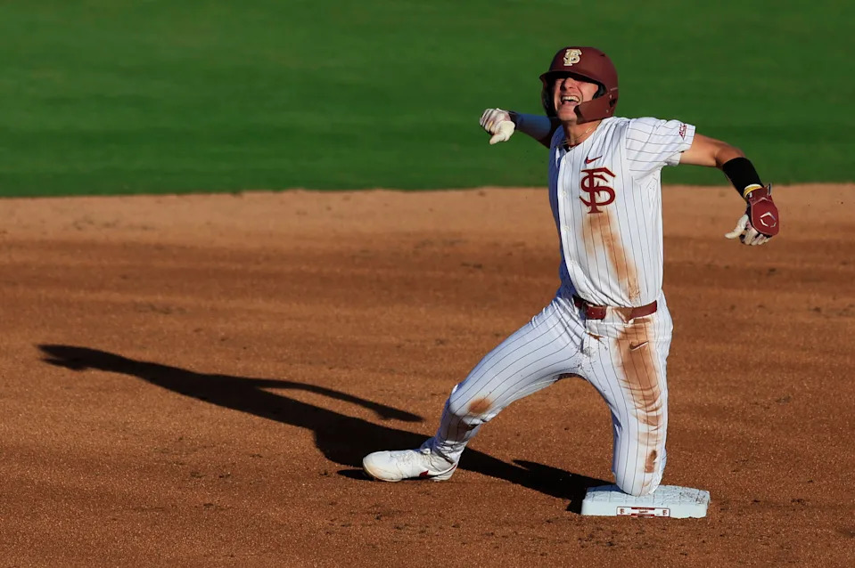Florida St. infielder Alex Lodise (1) reacts to his double at second base during the first inning against Florida.