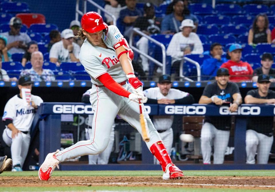 Philadelphia Phillies third baseman Alec Bohm (28) hits a two run single during the ninth inning of a game against the Miami Marlins on Monday, June 16, 2025 at loanDepot Park in Miami, Fla.