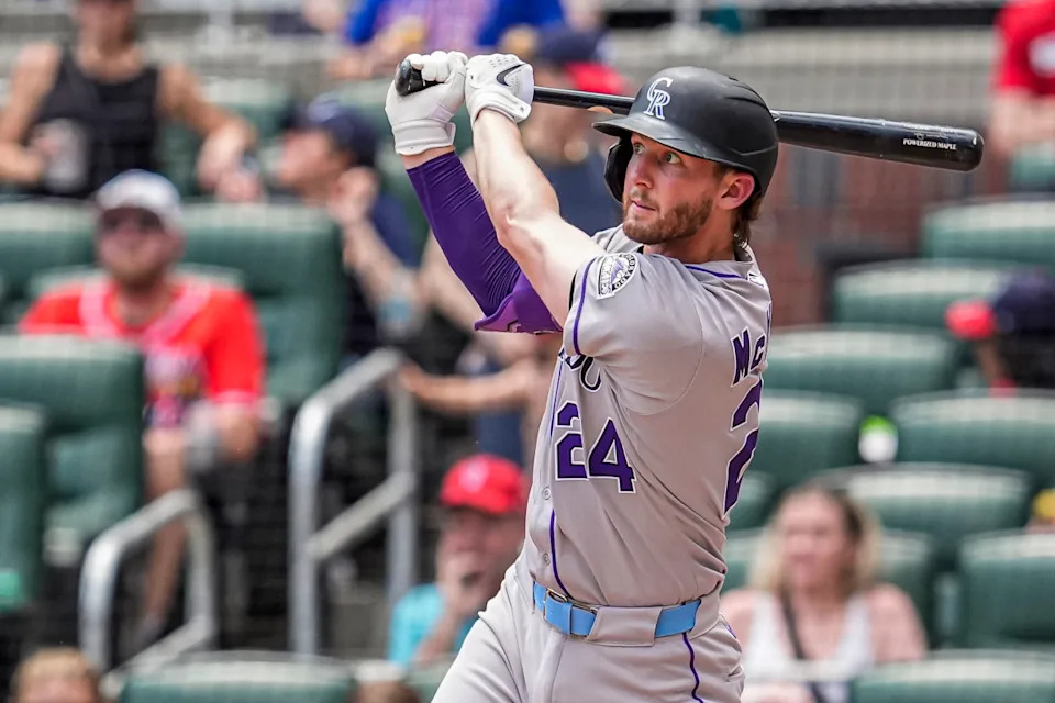 Colorado Rockies third baseman Ryan McMahon (24) hits a home run against the Atlanta Braves during the seventh inning at Truist Park.Dale Zanine-Imagn Images