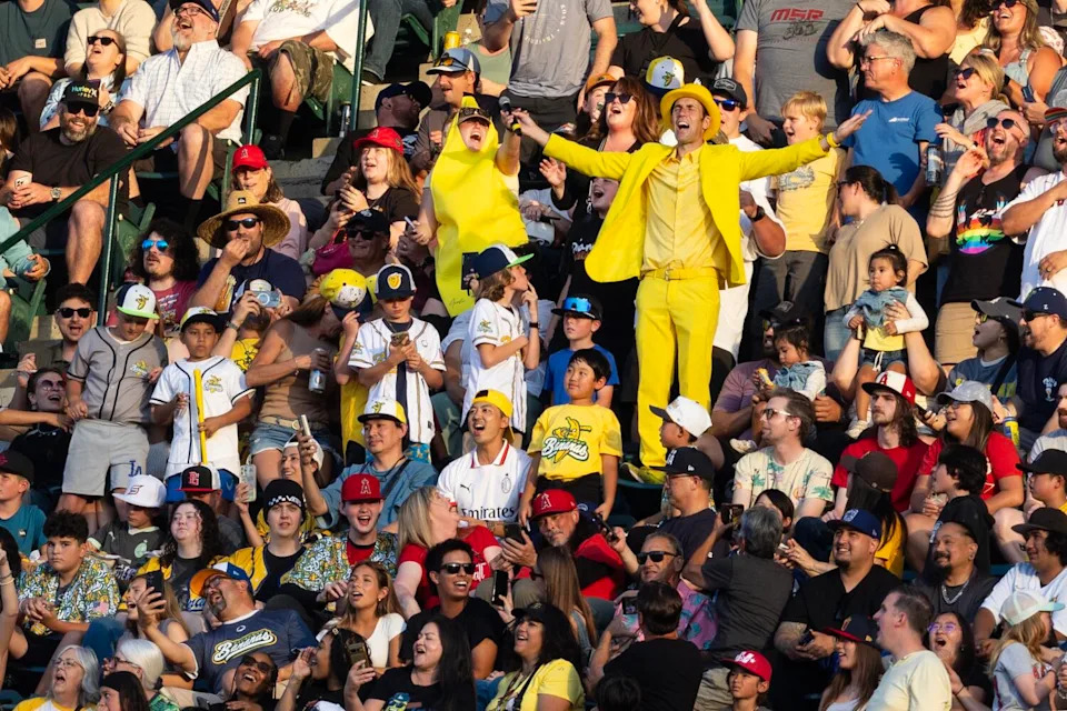 The Savannah Bananas' founder and owner Jesse Cole lead the crowd in a cheer.