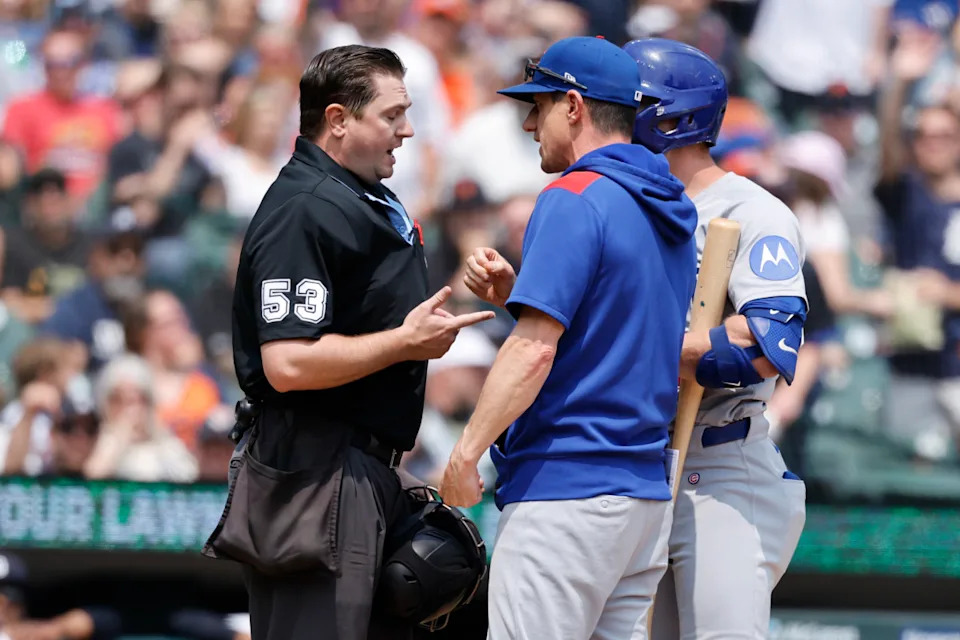 Chicago Cubs manager Craig Counsell (11) talks to umpire Derek Thomas in the fifth inning against the Detroit Tigers at Comerica Park.Rick Osentoski-Imagn Images