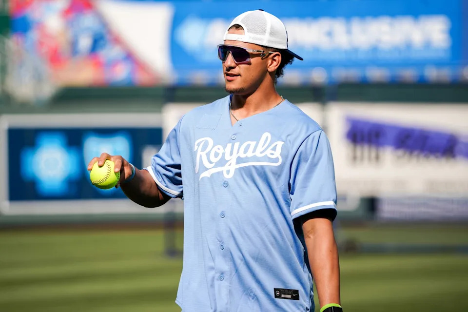 Kansas City Chiefs quarterback Patrick Mahomes wearing a Kansas City Royals jersey.Denny Medley-Imagn Images
