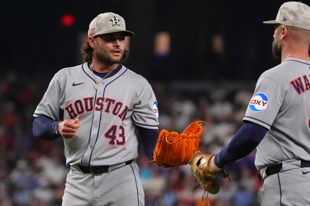 Lance McCullers Jr. and Christian Walker on a baseball field.
