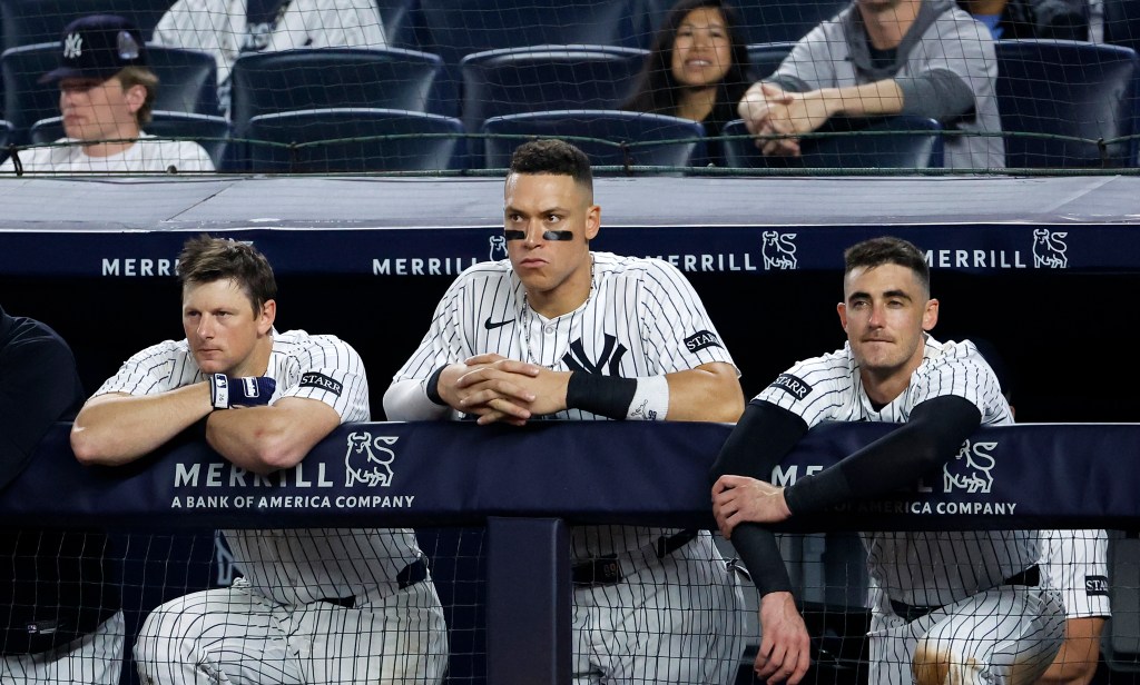 New York Yankees players in the dugout.
