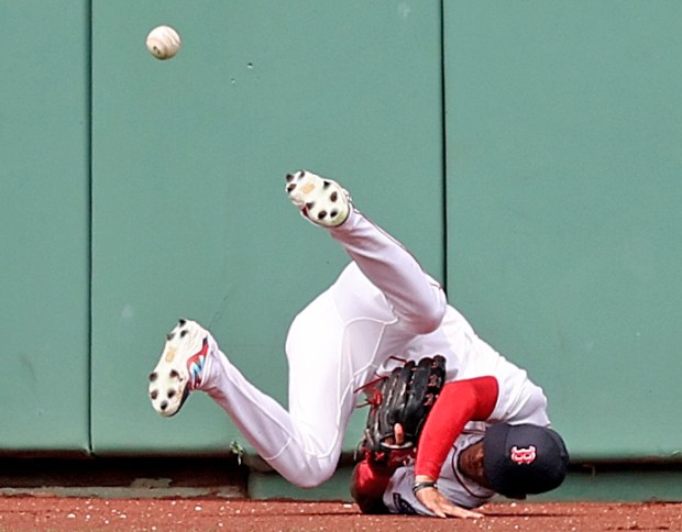 Outfielder Ceddanne Rafaela of the Boston Red Sox misses a triple off the bat of Zach Neto of the Los Angeles at Fenway Park. (Photo By Matt Stone/Boston Herald)