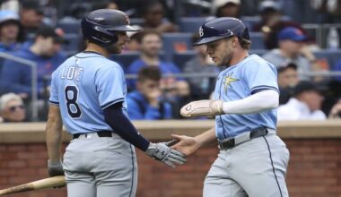 Tampa Bay Rays' Brandon Lowe, left, and Taylor Walls, right, react after Walls scored on a single hit by Josh Lowe during the third inning of a baseball game against the New York Mets Saturday, June 14, 2025, in New York. (AP Photo/Pamela Smith)