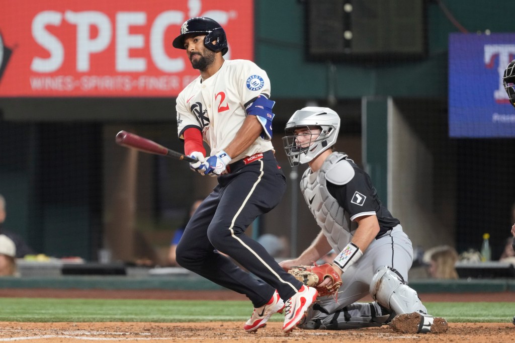 Texas Rangers' Marcus Semien hitting a double.