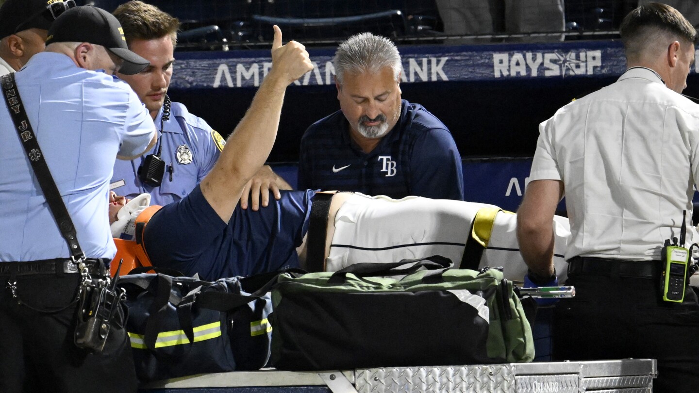 Rays pitcher carted off field and taken to hospital after foul ball into dugout hits him in face