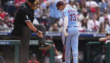 Marchán leads Harper-less Phillies over Braves 5-4 in doubleheader opener for 23rd win in 29 games
