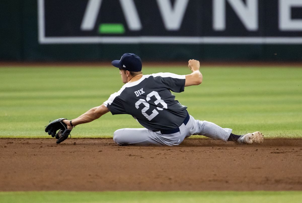 JD Dix dives for a ball during the MLB Draft Combine in 2024