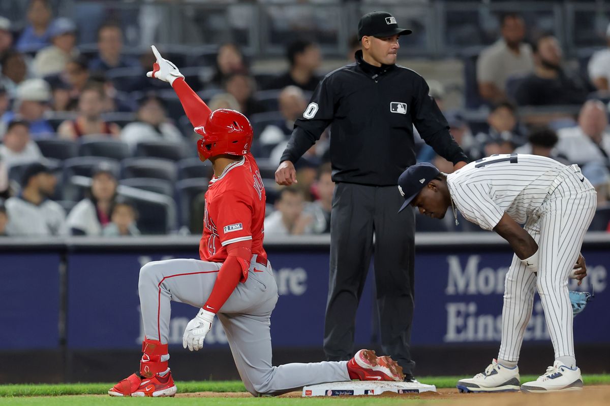 Los Angeles Angels second baseman Christian Moore (4) reacts after hitting a triple against the New York Yankees during the eighth inning at Yankee Stadium Los Angeles Angels second baseman Christian Moore (4) reacts after hitting a triple against the New York Yankees during the eighth inning at Yankee Stadium