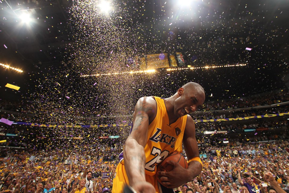 Kobe Bryant celebrating a Lakers victory amidst confetti.