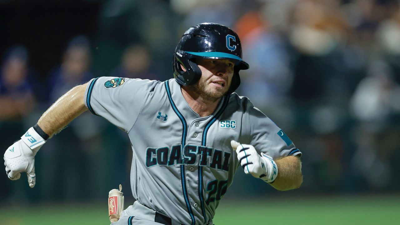 Coastal Carolina's Wells Sykes (20) runs to first base during an NCAA super regional baseball game against Auburn on Friday, June 6, 2025 in Auburn, Ala. (AP Photo/Stew Milne)