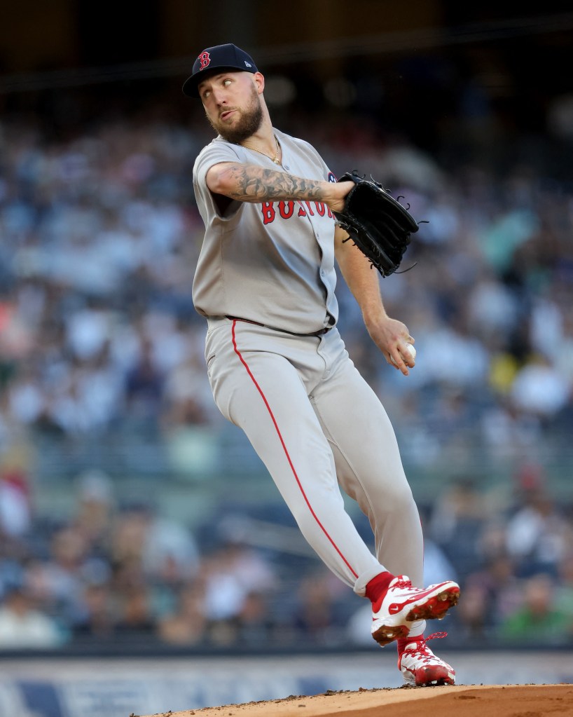 Boston Red Sox pitcher pitching a baseball.