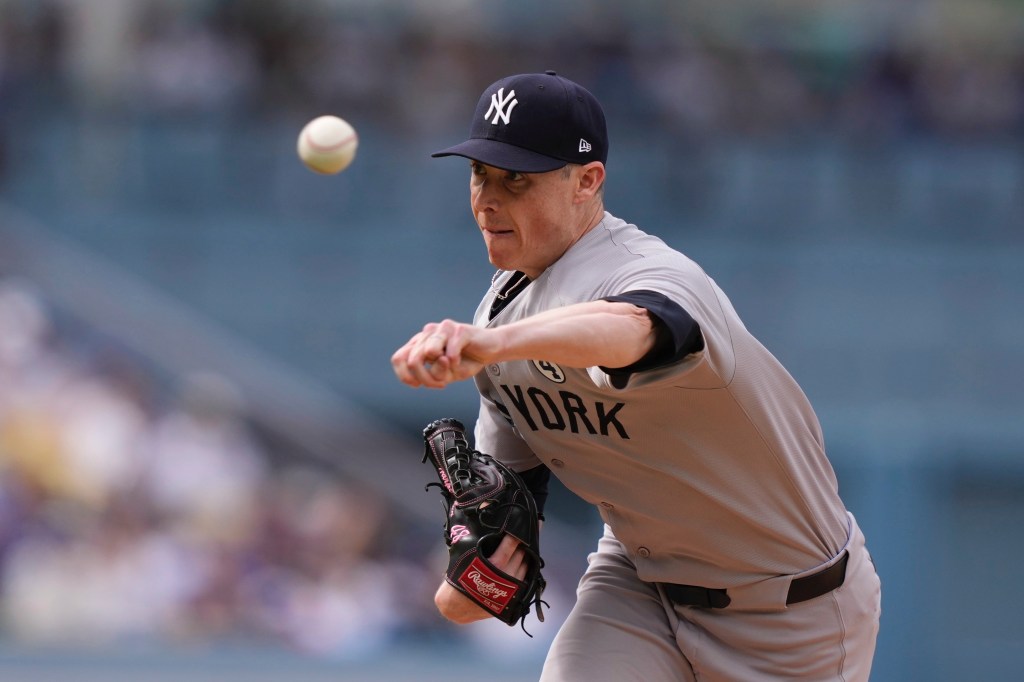 New York Yankees pitcher throwing a baseball.