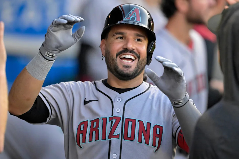 Jul 12, 2025; Anaheim, California, USA; Arizona Diamondbacks third baseman Eugenio Suarez (28) celebrates in the dugout after his second solo home run of the game during the fourth inning against the Los Angeles Angels at Angel Stadium. Mandatory Credit: Jayne Kamin-Oncea-Imagn Images