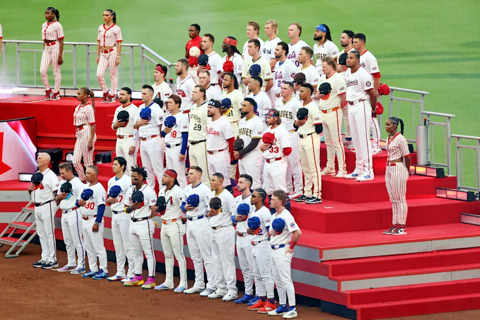 Jul 15, 2025; Cumberland, Georgia, USA; The National League All-Stars stand for the national anthem before the 2025 MLB All Star Game at Truist Park. Mandatory Credit: Jordan Godfree-Imagn Images