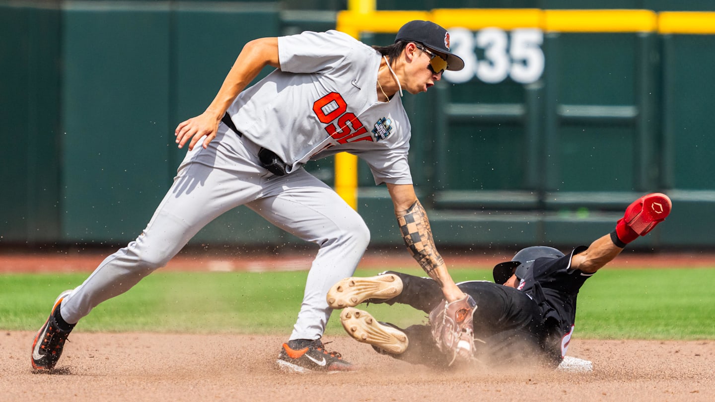 Jun 17, 2025; Omaha, Neb, USA; Louisville Cardinals shortstop Alex Alicea (0) steals second. Mandatory Credit: Dylan Widger-Imagn Images