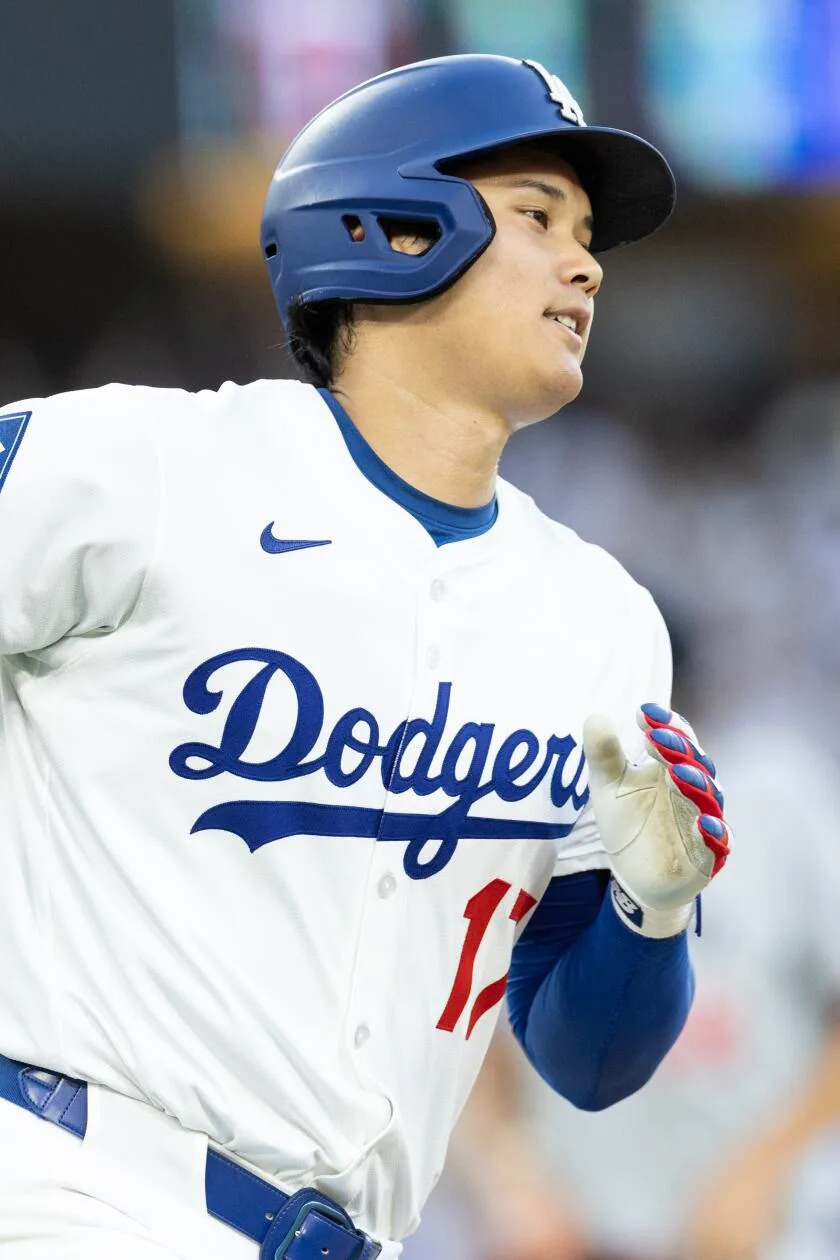 Shohei Ohtani rounds first after hitting a two-run homer Monday against the Twins.