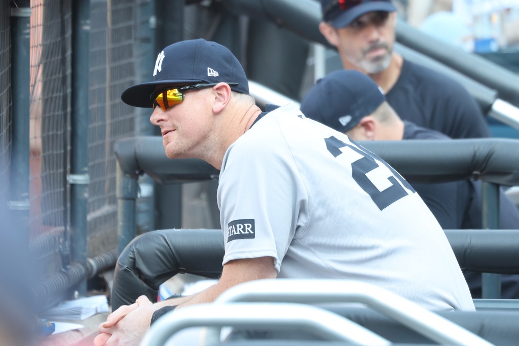 New York Yankees coach Aaron Boone in the dugout.