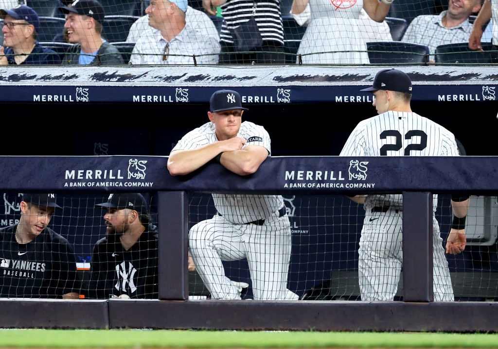 DJ LeMahieu (c.) in the Yankees dugout while out of the lineup for the Yankees' game against the Mariners on July 8, 2025.