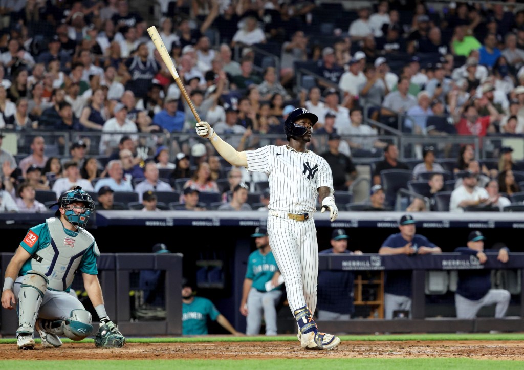 Baseball player Jazz Chisholm Jr. watches his home run.