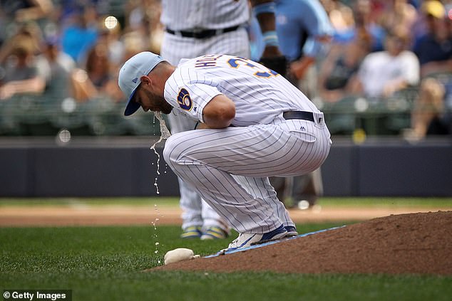 Houser vomits on the mound against the Philadelphia Phillies at Miller Park on June 17, 2018