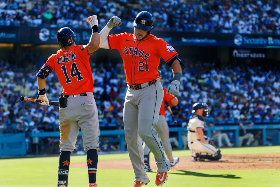 Houston Astros catcher Yainer Diaz celebrates with second baseman Mauricio Dubon.