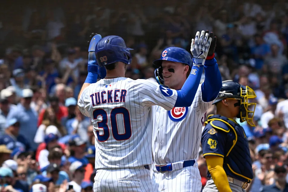 Chicago Cubs outfielder Pete Crow-Armstrong (4) high fives Kyle Tucker (30) after they score on his two-run home run against the Milwaukee Brewers during the first inning at Wrigley Field.Matt Marton&sol;Imagn Images