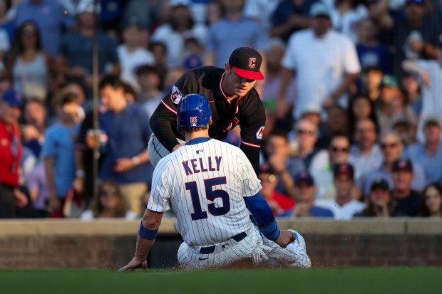 Guardians pitcher Gavin Williams tags out Cubs catcher Carson Kelly at home plate during the second inning Tuesday, July 1, 2025, at Wrigley Field. (Armando L. Sanchez/Chicago Tribune)