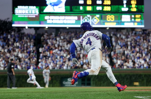 Chicago Cubs center fielder Pete Crow-Armstrong sprints around the bases en route to a run-scoring triple in the fourth inning of a game against the Cleveland Guardians at Wrigley Field in Chicago on July 2, 2025. (Chris Sweda/Chicago Tribune)